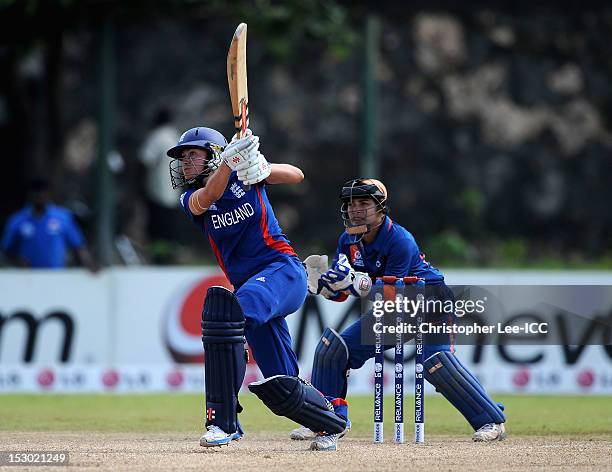 Laura Marsh of England in action as Sulakshana Naik of India stands by the stumps during the ICC Women's World Twenty20 2012 Group A match between...