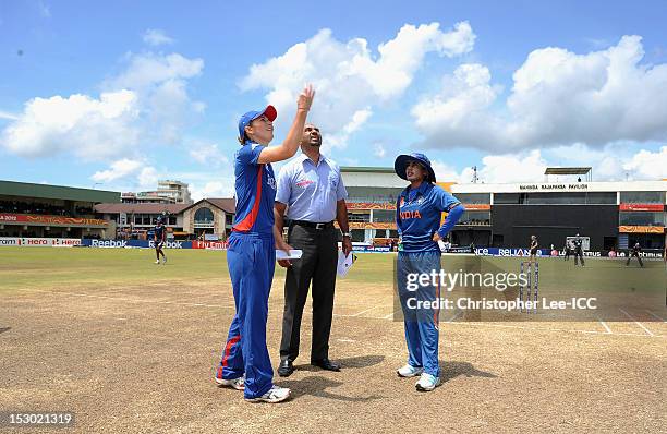 Charlotte Edwards of England and Mithali Raj of India toss the coin during the ICC Women's World Twenty20 2012 Group A match between England and...