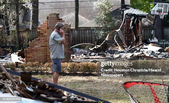 Rob Hooper Robert Hooper speaks on the phone while pacing back and forth in ...