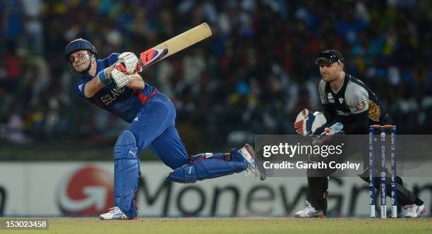 Luke Wright of England hits out for six runs watched by New Zealand wicketkeeper Brendon McCullum during the ICC World Twenty20 2012 Super Eights...