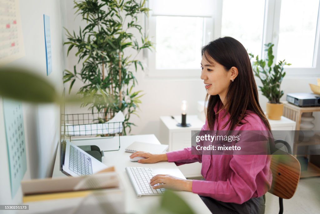 Young beautiful well dressed woman working at modern office