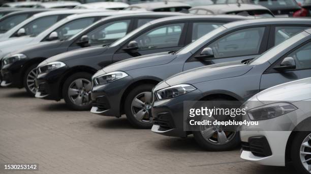 used bmw cars parked at a public car dealership - bilmärken bildbanksfoton och bilder