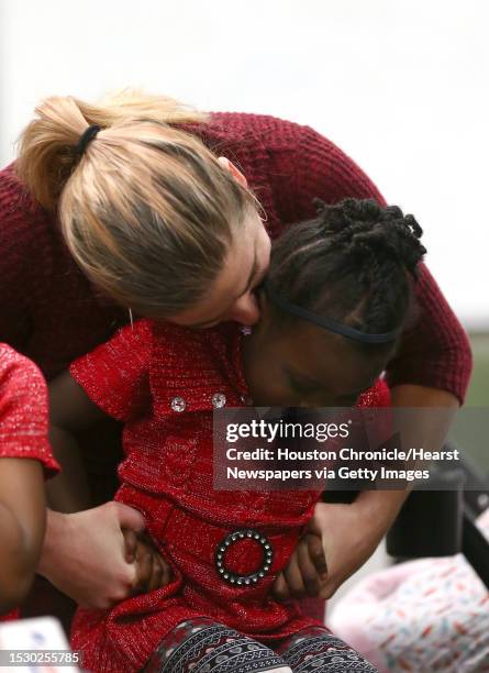 Samantha Davis kisses newly adopted four-year-old daughter Aubrii while finalizing her adoption inside the Juvenile Justice Center Friday, Nov. 17 in...