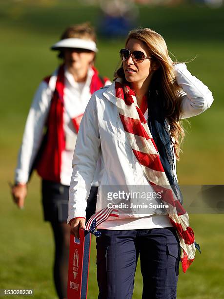 Jillian Stacey follows the play of Keegan Bradley during day two of the Morning Foursome Matches for The 39th Ryder Cup at Medinah Country Club on...