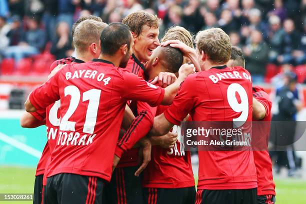 Sidney Sam of Leverkusen celebrates his team's first goal with team mates during the Bundesliga match between Bayer 04 Leverkusen and SpVgg Greuther...