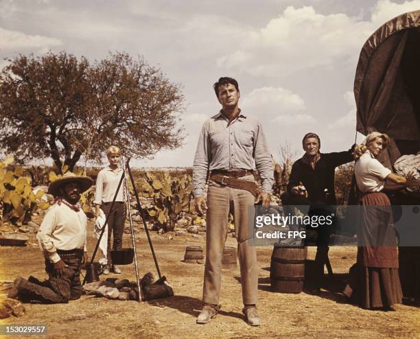 From second left, American actors Carol Lynley , Rock Hudson , Kirk Douglas , and Dorothy Malone in a scene from the film 'The Last Sunset,' 1961.