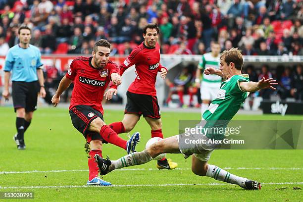 Dani Carvajal of Leverkusen is blocked by Thomas Kleine of Greuther Fuerth during the Bundesliga match between Bayer 04 Leverkusen and SpVgg Greuther...
