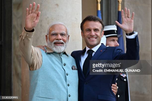 French President Emmanuel Macron welcomes Indian Prime Minister Narendra Modi for a dinner at the Elysee Palace in Paris on July 13, 2023. Indian...