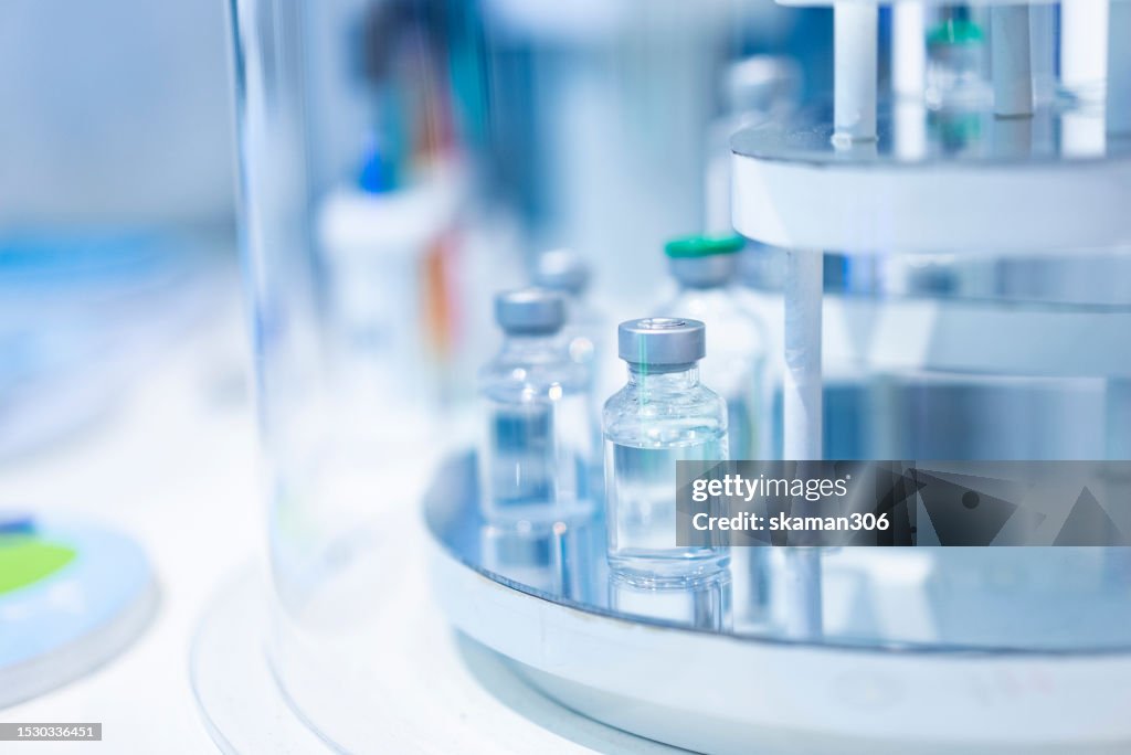 Medical Vial Vaccine on Shelf Table - Healthcare Concept for Pharmaceutical Research