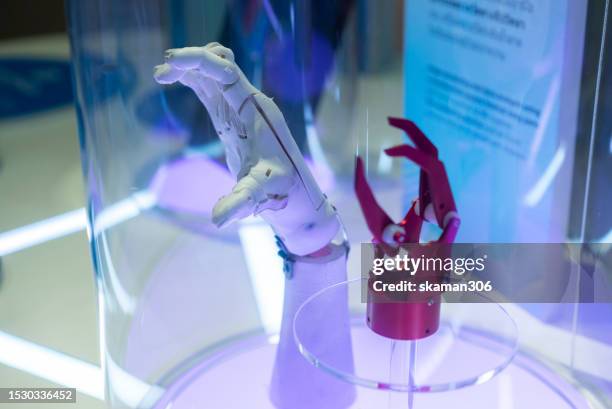 empowering independence robotic arm revolutionizing mobility support for people with arm impairments - bionic limbs stock pictures, royalty-free photos & images