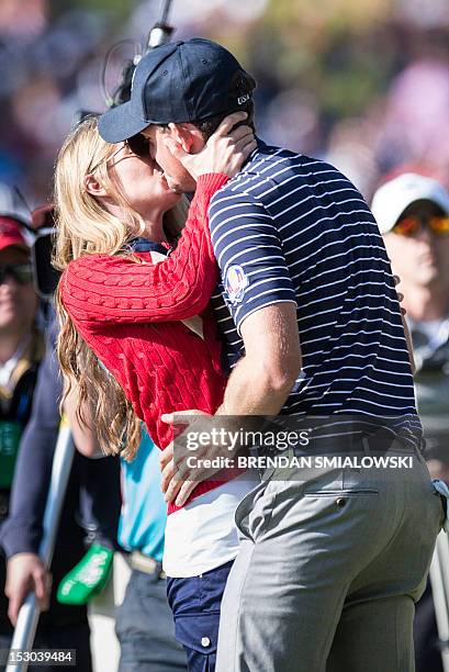 Team USA's Keegan Bradley is kissed by his girlfriend Jillian Stacey after winning during the morning Four Ball Match on the second day of the 39th...