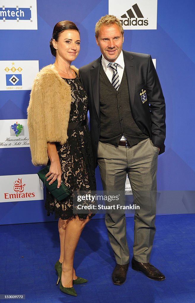 Thorsten Fink, head caoch of Hamburg and his wife Silke Fink pose for