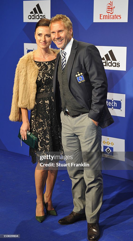 Thorsten Fink, head coach of Hamburg and his wife Silke Fink pose for
