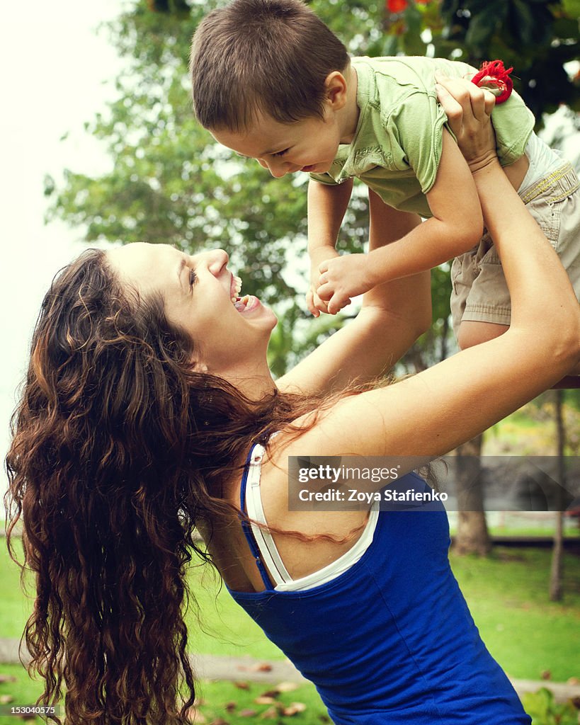 Mother holding little son in hands