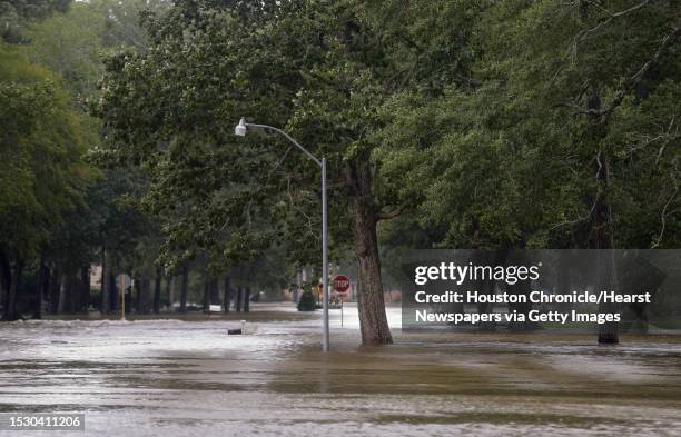 Afton Way flooded after Luce Bayou overflowed during Tropical Storm Imelda Friday, Sept. 20 in Huffman, Texas.