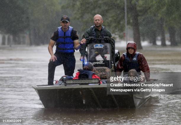 First responders with the Harris County Sheriff's Office, Texas Game Warden, and Huffman Fire Department rescued people from flooded homes in the...