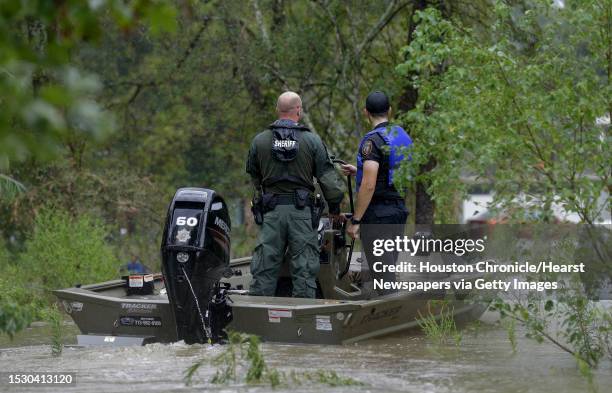 Harris County Sheriff's Office deputies look for people wanting to leave their flooded homes in the Lochshire neighborhood Friday, Sept. 20 in...