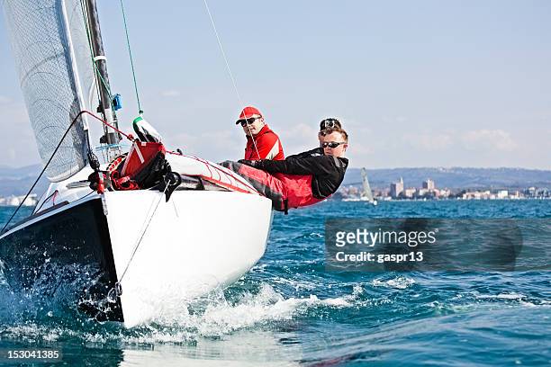 men enjoying the sport of sailing - sail stock pictures, royalty-free photos & images