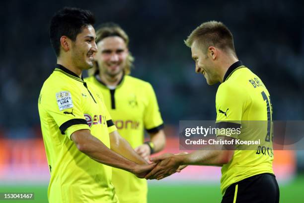 Jakub Blaszczykowski of Dortmund celebrates the fifth goal with Ilkay Guendogan during the Bundesliga match between Borussia Dortmund and VfL...