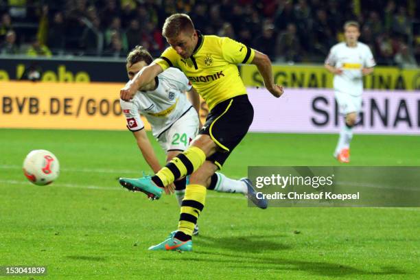 Jakub Blaszczykowski of Dortmund scores the fifth goal during the Bundesliga match between Borussia Dortmund and VfL Borussia Moenchengladbach at...