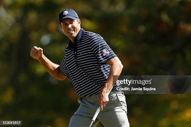 Matt Kuchar of the USA celebrates a birdie putt on the fourth green during day two of the Afternoon Four-Ball Matches for The 39th Ryder Cup at...