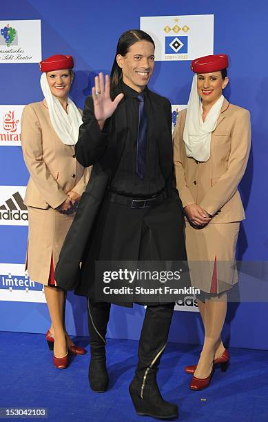 Catwalk trainer Jorge Gonzalez poses for a picture on the blue carpet prior to the Hamburger SV 125th anniversary gala at O2 World on September 29,...