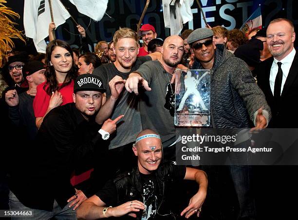 Stefan Raab and Sandra Riess, Tim Bendzko, Kool Savas, Xavier Naidoo and Stefan Raab pose for the media after the 'Bundesvision Song Contest 2012' at...