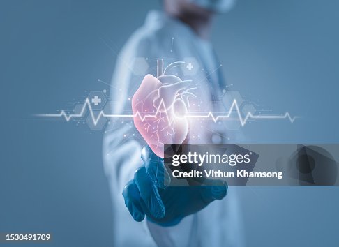 Doctor touching Heart icon for treatment and healthcare of technology digital futuristic concept. Doctor touching Heart icon for treatment and healthcare of technology digital futuristic concept.