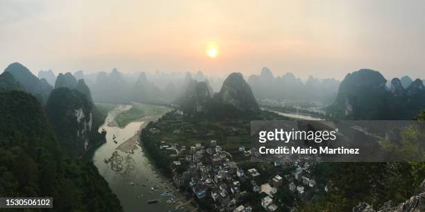 guilin landscape at sunset from mountain peak - xingping stock pictures, royalty-free photos & images