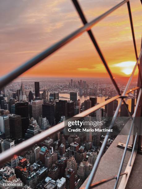 cityscape at sunrise from the top of the empire state building - top of empire state building stock pictures, royalty-free photos & images