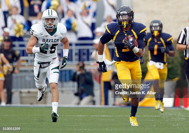 Stedman Bailey of the West Virginia Mountaineers catches an eighty seven yard touchdown pass against the Baylor Bears during the game on September...