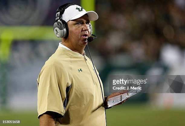 Head coach Skip Holtz of the South Florida Bulls directs his team against the Rutgers Scarlet Knights during the game at Raymond James Stadium on...