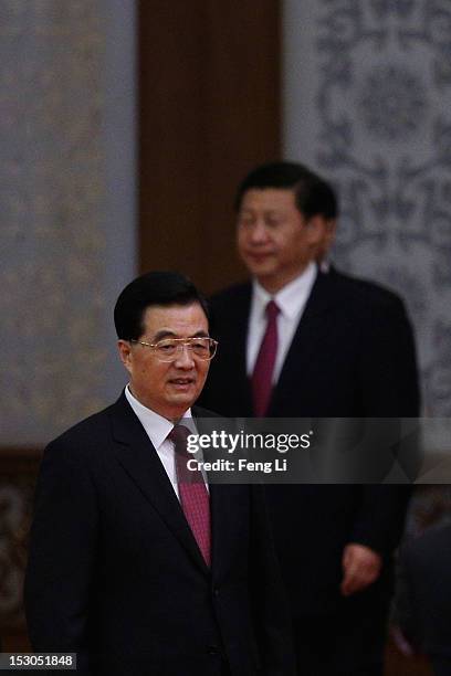 Chinese President Hu Jintao and Chinese Vice President Xi Jinping attend the banquet marking the 63th anniversary of the founding of the People's...