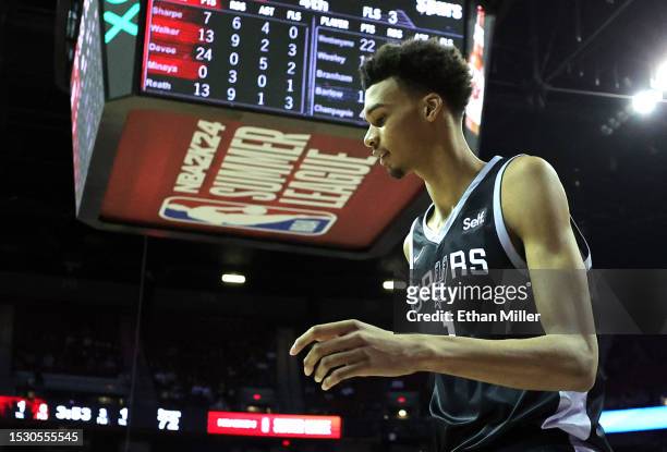 Victor Wembanyama of the San Antonio Spurs reacts after he was called for an offensive charge against the Portland Trail Blazers in the second half...