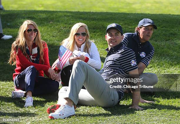 Team USA's Keegan Bradley, 2nd from right, and teammate Phil Mickelson, right, watch the action with Phil's wife Amy Mickelson, center, and Keegan...