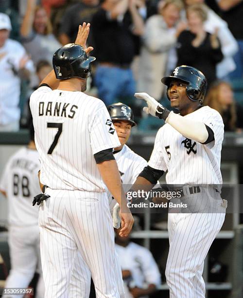 Orlando Hudson of the Chicago White Sox is greeted by Jordan Danks after hitting a grand-slam homer against the Tampa Bay Rays in the eighth inning...