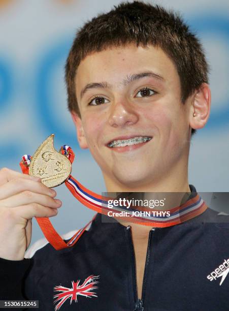 Great Britain's Thomas Daley poses with is gold medal of the men's 10m platform diving final of the 29th LEN European Swimming Championships, on...