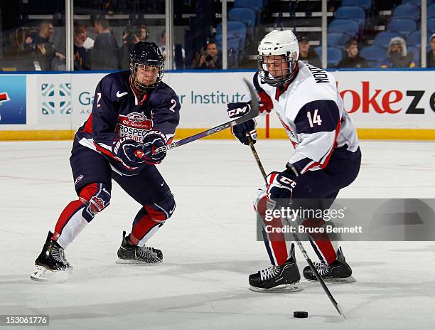 Keaton Thompson of Team Housley defends against Jacob Montgomery of Team McClanahan at the USA Hockey All-American Prospects Game at the First...