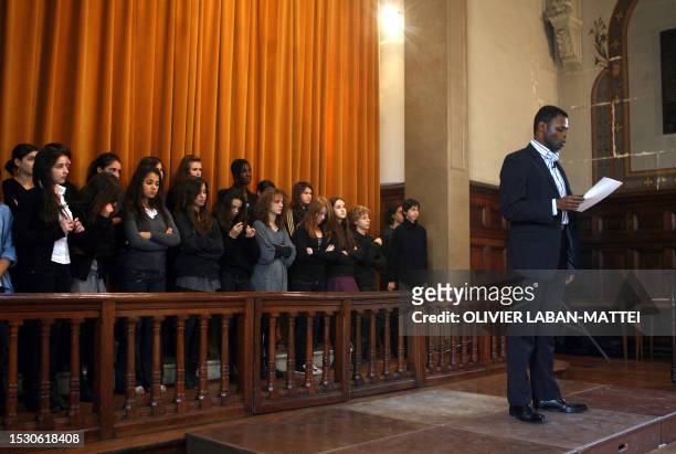 Man sings "Le chant des Partisans" at Paris Jacques Decour school after a schooboy read in the school chapel a copy of the farewell letter written by...
