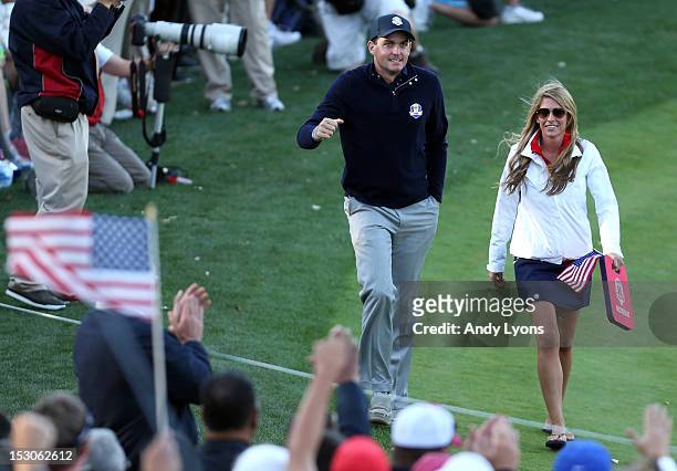 Keegan Bradley of the USA walks with his girlfriend Jillian Stacey during day two of the Afternoon Four-Ball Matches for The 39th Ryder Cup at...