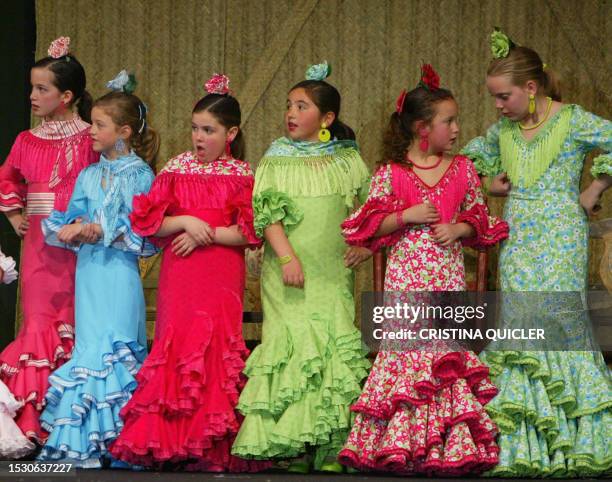 Youngs models wears gowns by Spanish designer Nuevo Montecarlo during the Simof 'Salon International of Flamenco Fashion' show at the conference...