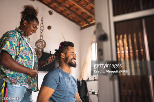 hairdresser taking care of afro hair - braid hairstyle stock pictures, royalty-free photos & images