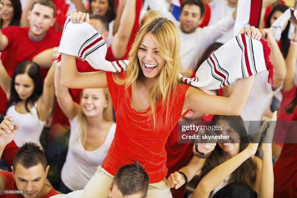Group of sport fans cheering.