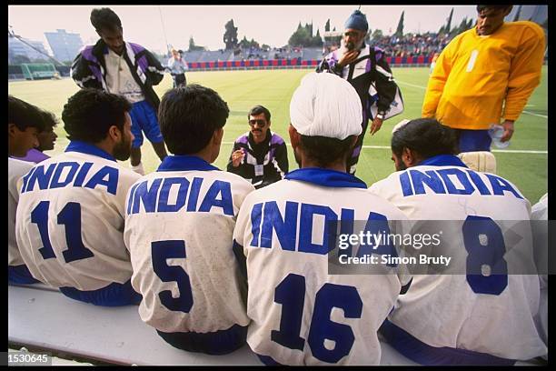 The Indian half-time team talk during a feature on field hockey in India. Mandatory Credit: Simon Bruty/Allsport