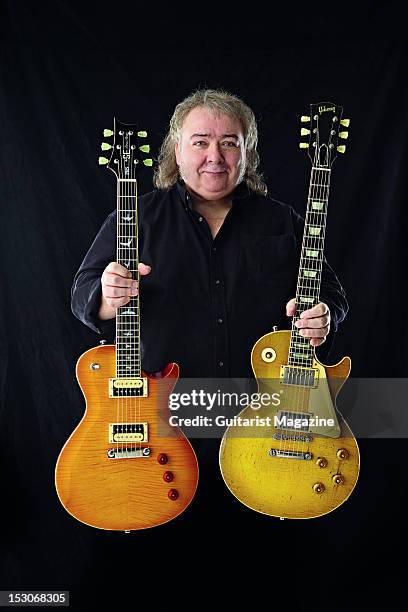 English rock guitarist Bernie Marsden, famous for his work with English rock band Whitesnake, holding his PRS SE Bernie Marsden Signature and 1959...