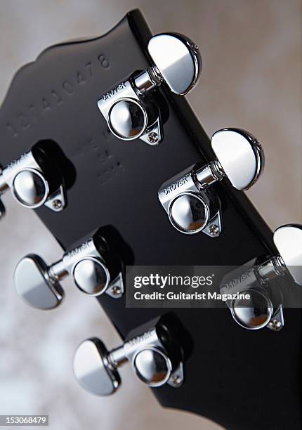 The headstock and Grover tuners of a Gibson Midtown custom electric guitar, during a studio shoot for Guitarist Magazine/Future via Getty Images,...