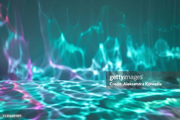 abstract empty underwater 3d stage with dark emerald green and pink dreamy water light waves texture. imaginative fantasy landscape with surreal light effects. - stage light 3d stock pictures, royalty-free photos & images