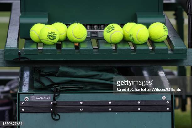 Tennis balls lined up during day ten of The Championships Wimbledon 2023 at All England Lawn Tennis and Croquet Club on July 12, 2023 in London,...