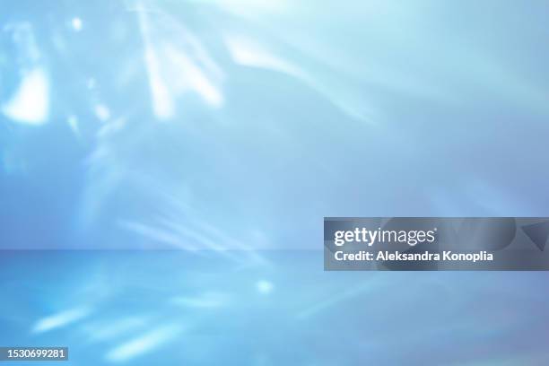 futuristic abstract 3d pattern - pastel blue empty stage with ethereal caustic  light and shadows effect. - stage light 3d stock pictures, royalty-free photos & images