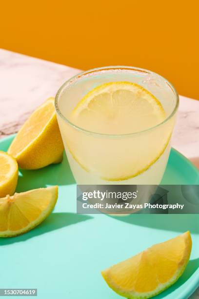 fresh homemade lemonade glass on a marble surface - lime juice stock pictures, royalty-free photos & images